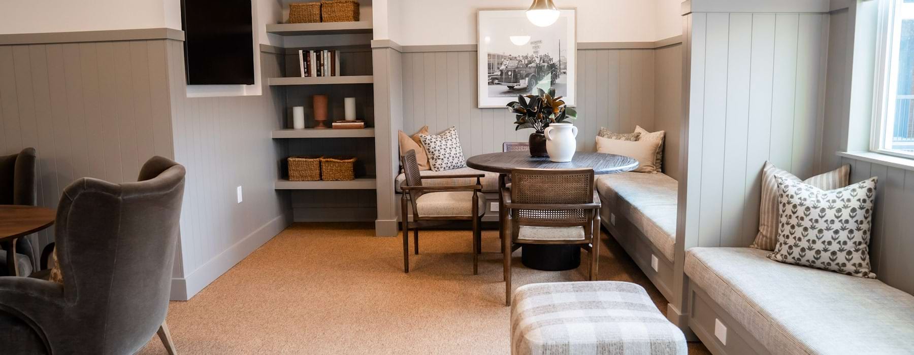 room with couch table and chairs
